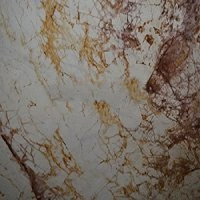 Close up of Breccia Romano granite which is white with large veins running through