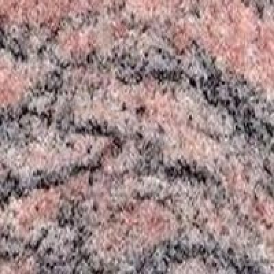 A pink and black coloured granite