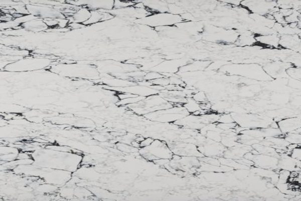 White with a darl grey pattern running through making it look like natural marble