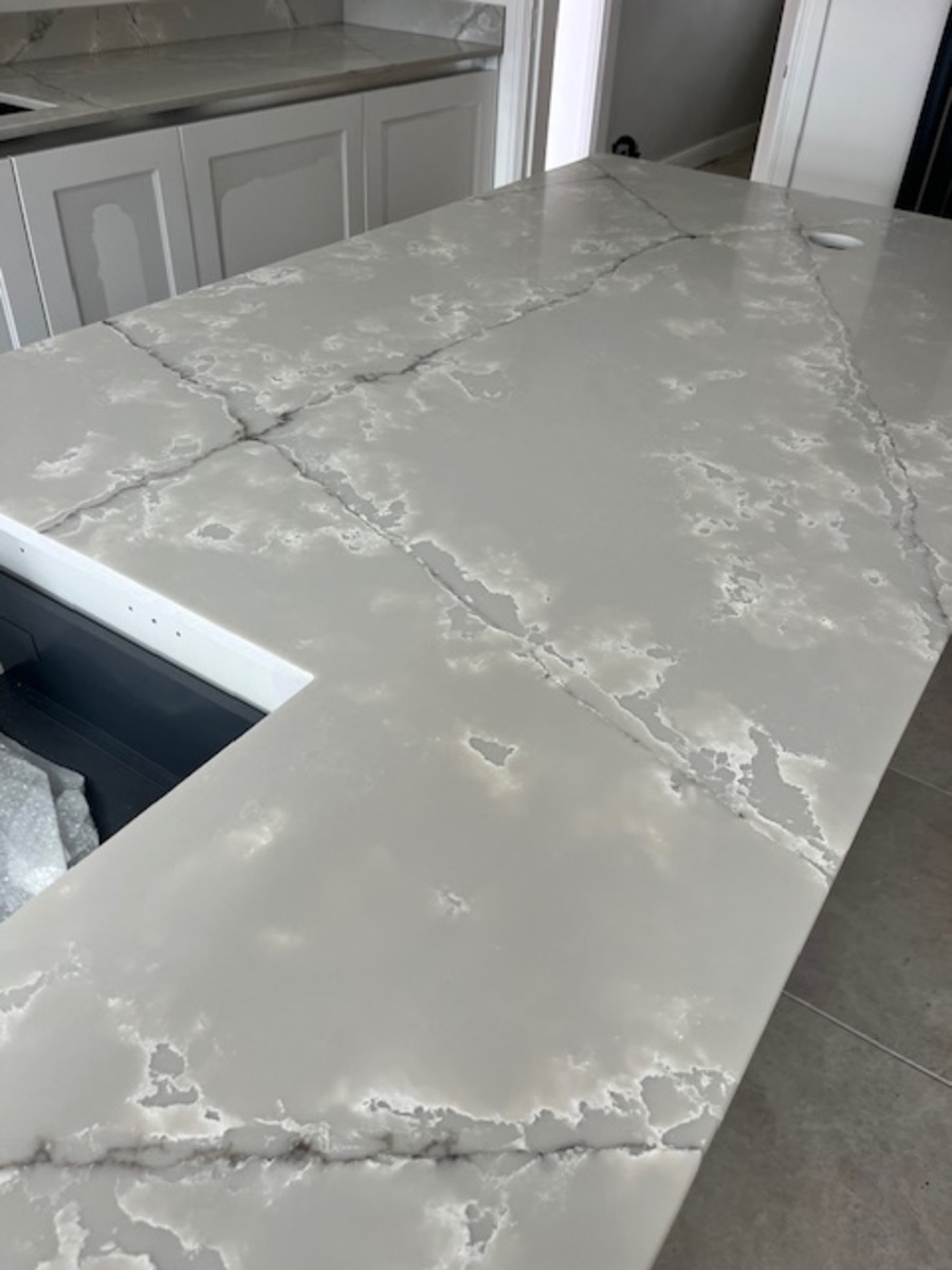 Ice White qQuartz which is grey in colour with a dark pattern running through installed in Westhoughton Bolton