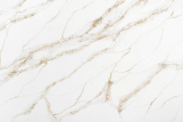Calacatta marble-inspired quartz, featuring a bright white background with bold, dynamic rust and grey veining