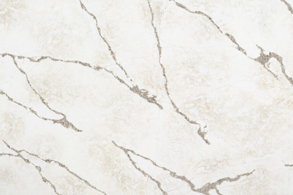 Ijen Blue quartzite-inspired quartz, featuring an off-white, grey and brown background with dynamic brown veining